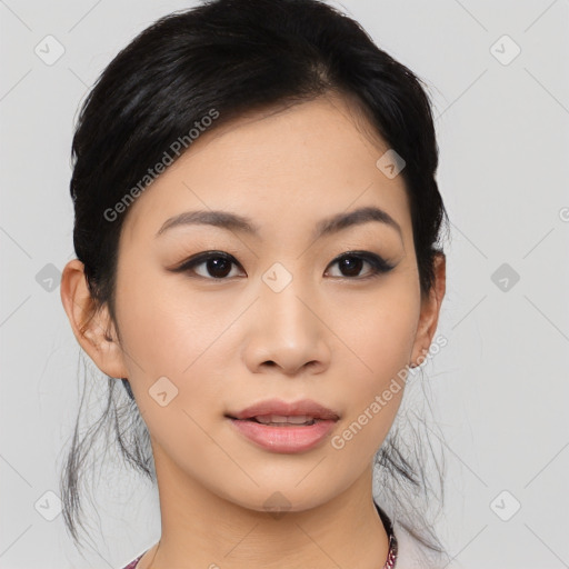 Joyful asian young-adult female with medium  black hair and brown eyes