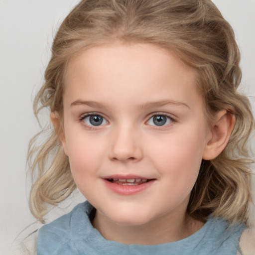 Joyful white child female with medium  brown hair and blue eyes