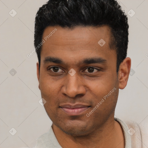 Joyful latino young-adult male with short  black hair and brown eyes