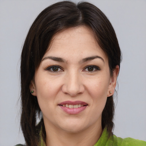 Joyful white young-adult female with medium  brown hair and brown eyes