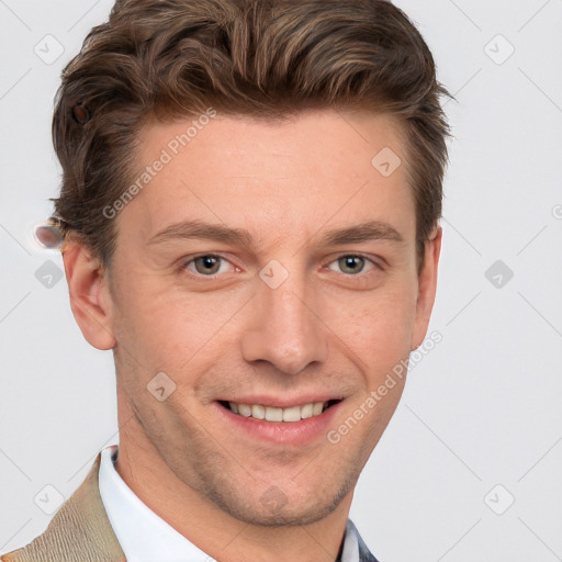 Joyful white adult male with short  brown hair and blue eyes