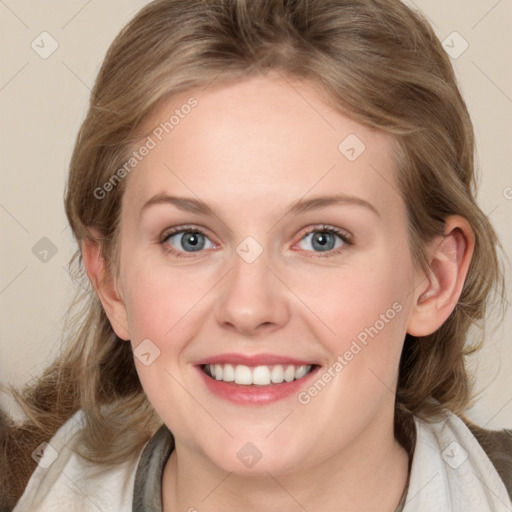 Joyful white young-adult female with medium  brown hair and blue eyes