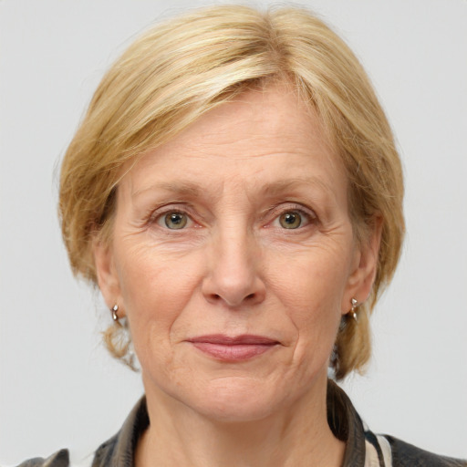 Joyful white middle-aged female with medium  brown hair and blue eyes