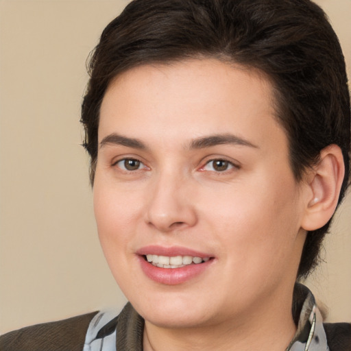 Joyful white young-adult female with medium  brown hair and brown eyes