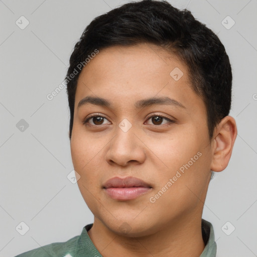 Joyful latino young-adult female with short  black hair and brown eyes