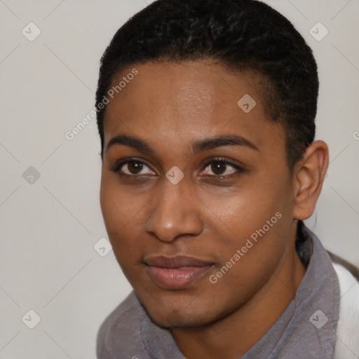 Joyful black young-adult female with short  black hair and brown eyes