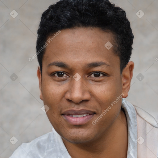 Joyful black young-adult male with short  black hair and brown eyes