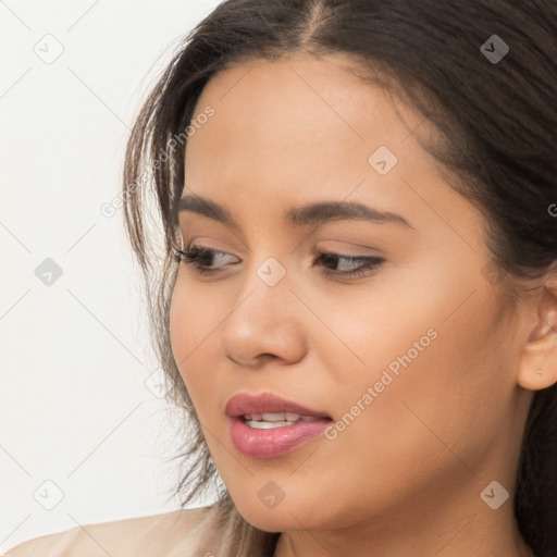 Joyful latino young-adult female with long  brown hair and brown eyes