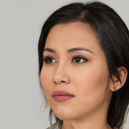 Neutral asian young-adult female with medium  black hair and brown eyes