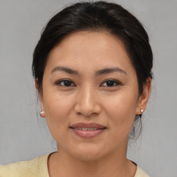 Joyful white young-adult female with medium  brown hair and brown eyes