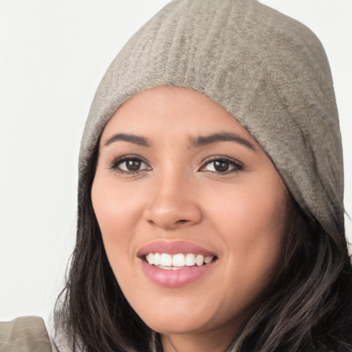 Joyful white young-adult female with long  black hair and brown eyes