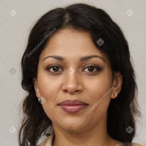 Joyful latino young-adult female with long  brown hair and brown eyes