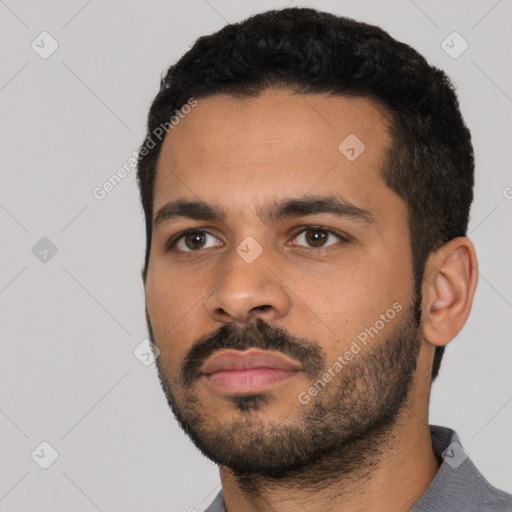 Neutral latino young-adult male with short  black hair and brown eyes