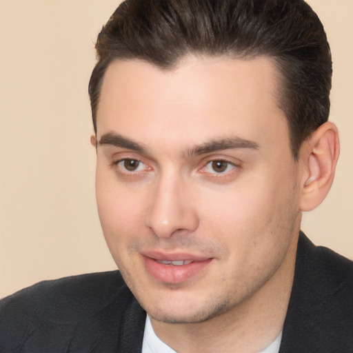 Joyful white young-adult male with short  brown hair and brown eyes