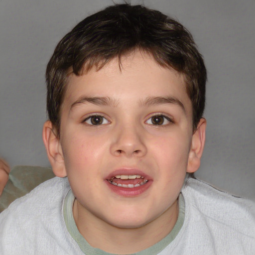 Joyful white child male with short  brown hair and brown eyes