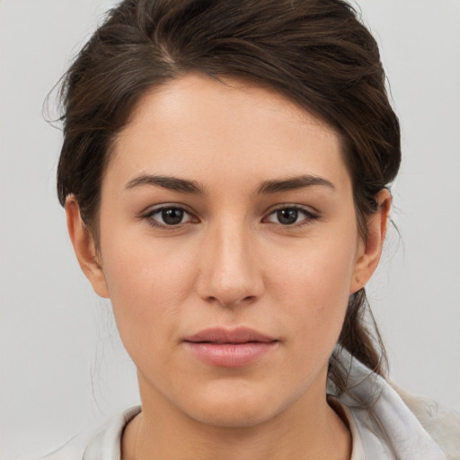 Neutral white young-adult female with short  brown hair and brown eyes