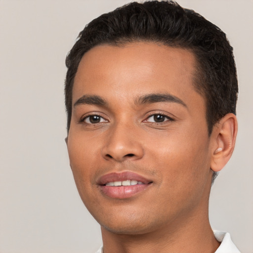 Joyful white young-adult male with short  black hair and brown eyes