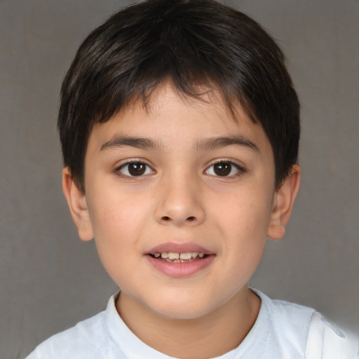 Joyful white child male with short  brown hair and brown eyes