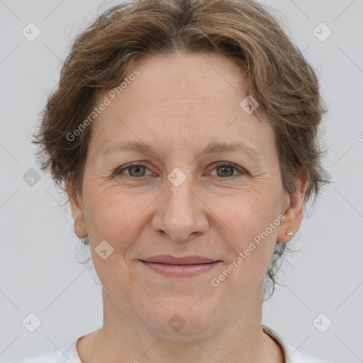 Joyful white adult female with short  brown hair and brown eyes