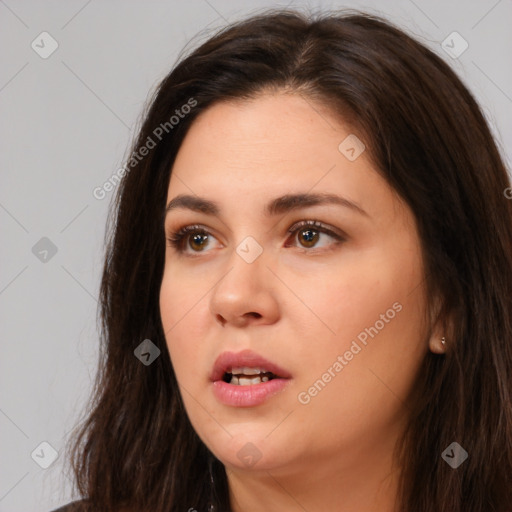 Neutral white young-adult female with long  brown hair and brown eyes