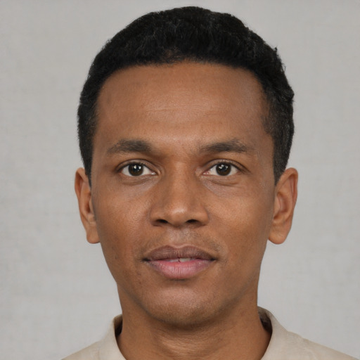 Neutral black young-adult male with short  black hair and brown eyes