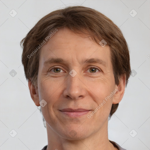 Joyful white adult male with short  brown hair and grey eyes