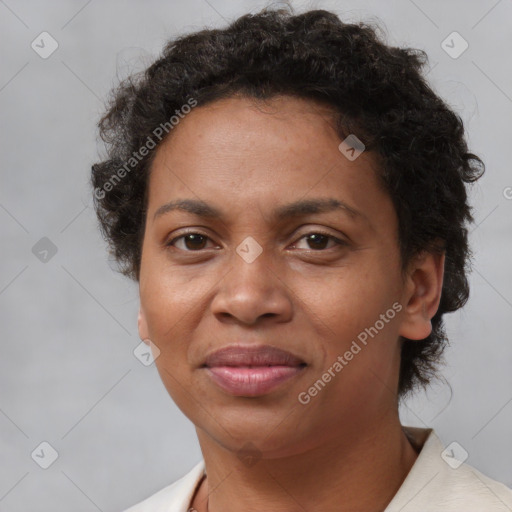 Joyful black adult female with short  brown hair and brown eyes