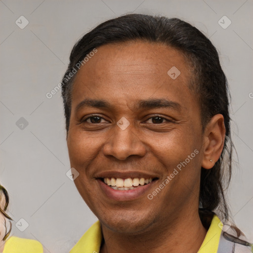 Joyful latino young-adult male with short  brown hair and brown eyes