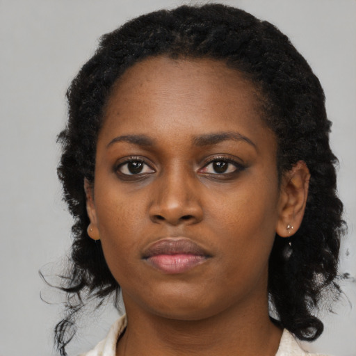 Neutral black young-adult female with long  black hair and brown eyes