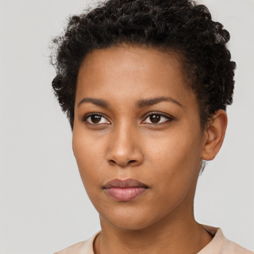 Neutral black young-adult female with short  brown hair and brown eyes