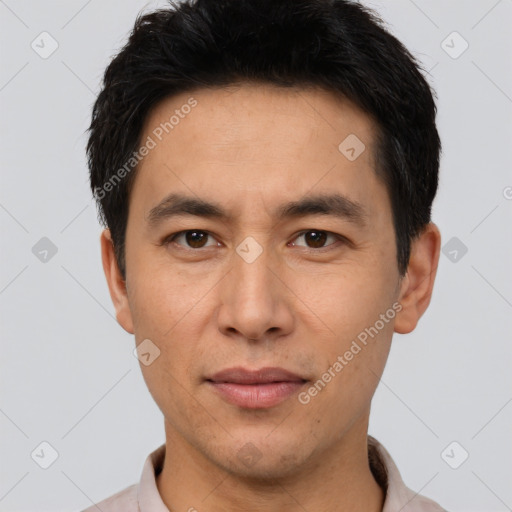 Joyful white young-adult male with short  black hair and brown eyes