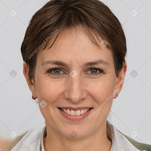 Joyful white adult female with short  brown hair and grey eyes