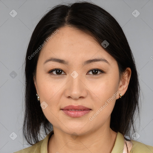 Joyful asian young-adult female with medium  brown hair and brown eyes