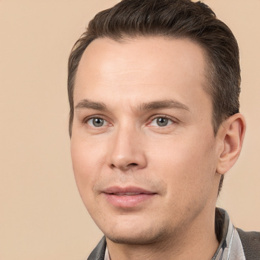 Joyful white young-adult male with short  brown hair and brown eyes