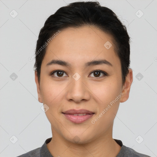 Joyful asian young-adult female with short  black hair and brown eyes