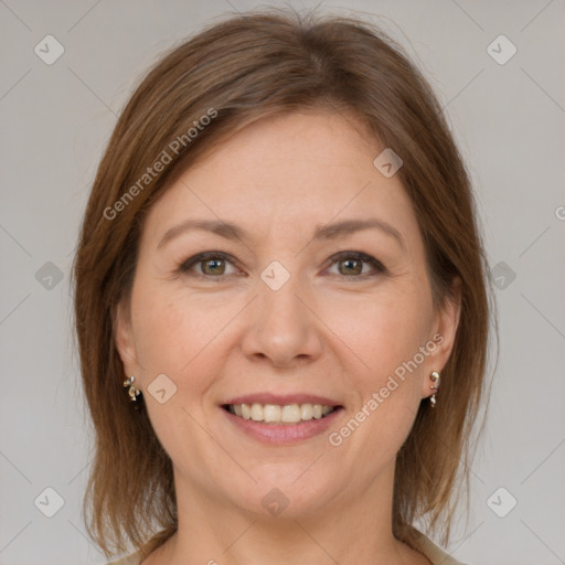 Joyful white adult female with medium  brown hair and grey eyes