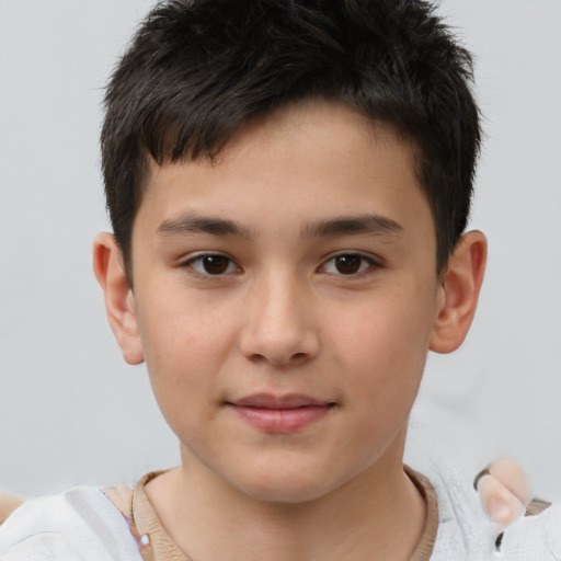 Joyful white child male with short  brown hair and brown eyes