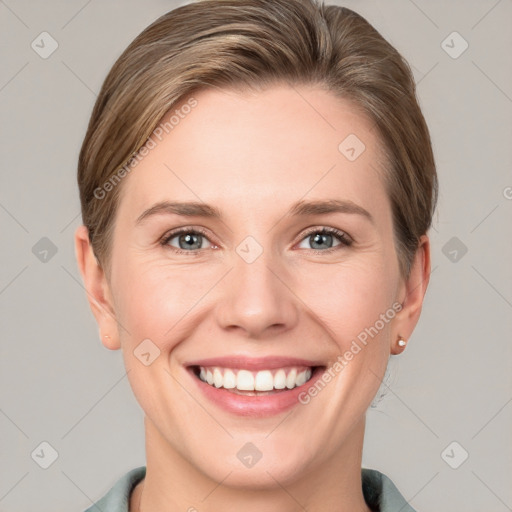 Joyful white young-adult female with short  brown hair and grey eyes