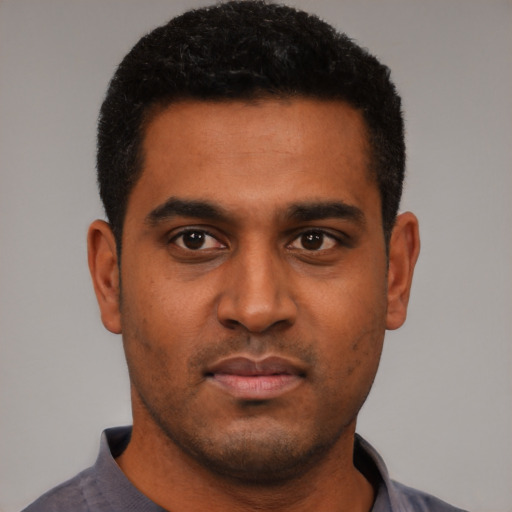 Neutral black young-adult male with short  black hair and brown eyes