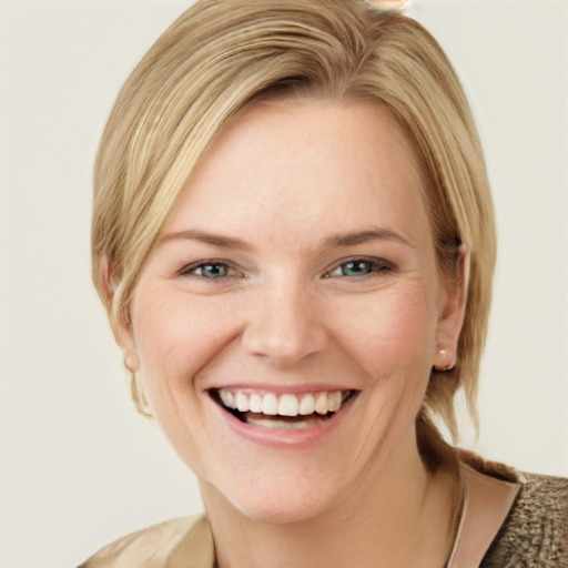 Joyful white young-adult female with medium  blond hair and green eyes