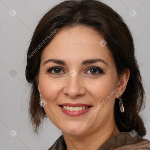 Joyful white adult female with medium  brown hair and brown eyes