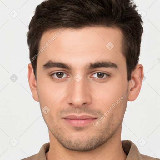 Joyful white young-adult male with short  brown hair and brown eyes