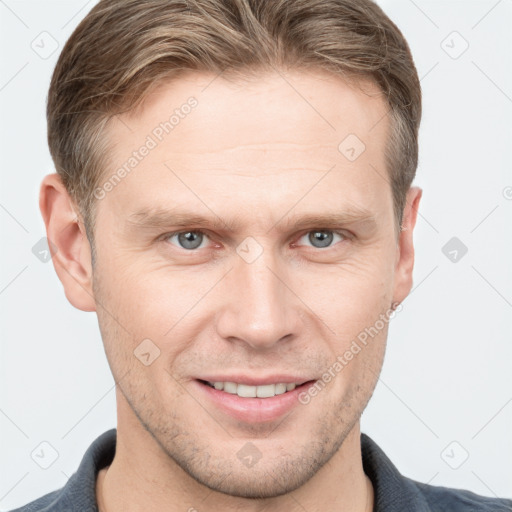 Joyful white young-adult male with short  brown hair and grey eyes