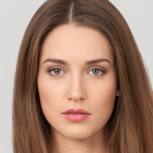 Neutral white young-adult female with long  brown hair and brown eyes