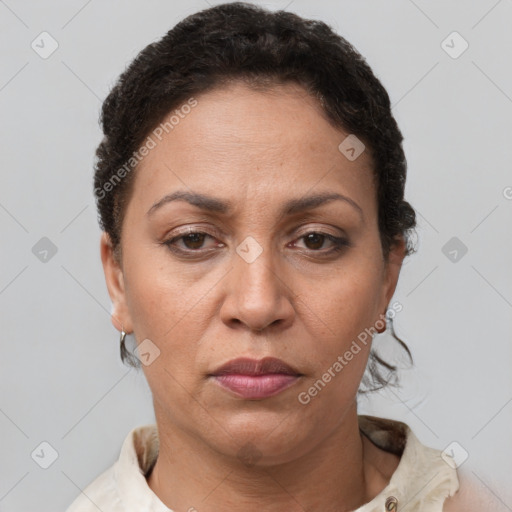 Joyful white adult female with short  brown hair and brown eyes