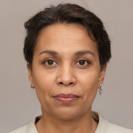 Joyful white adult female with short  brown hair and brown eyes