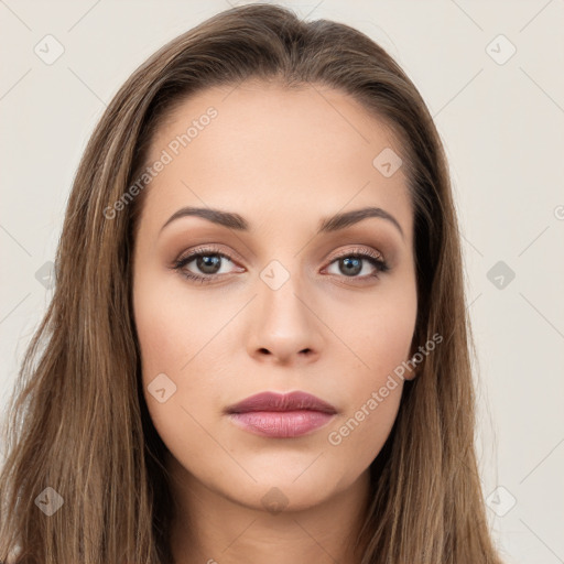 Neutral white young-adult female with long  brown hair and brown eyes