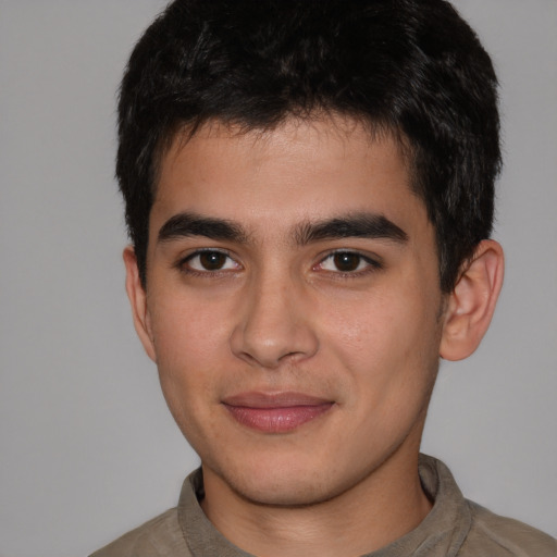 Joyful asian young-adult male with short  brown hair and brown eyes