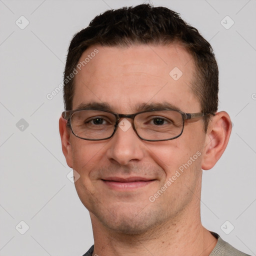 Joyful white adult male with short  brown hair and grey eyes