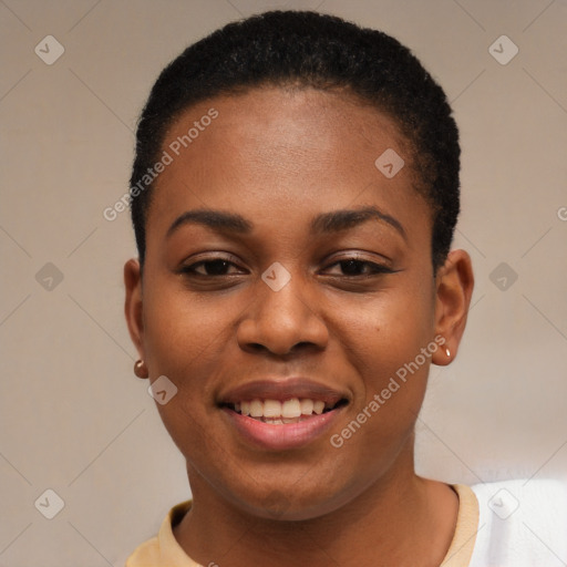 Joyful black young-adult female with short  black hair and brown eyes